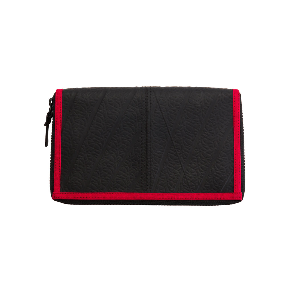 Paguro Upcycle black travel pouch with red trim and zip closure made from textured tyre material recycled rubber travel organiser