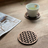 Paguro Upcycle Japanese pattern drink coasters made of wood with geometric cutout design on wooden table