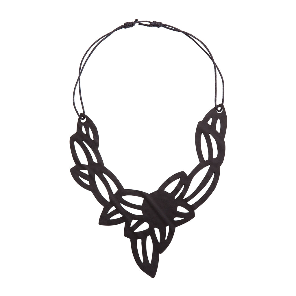 Paguro Upcycle black vegan inner tube necklace with intricate leaf-inspired cutout design