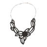 Paguro Upcycle vegan inner tube necklace with black cutout design and silver chain