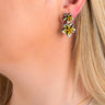 Paguro Upcycle floral reclaimed wood earrings with yellow and white petals worn on ear