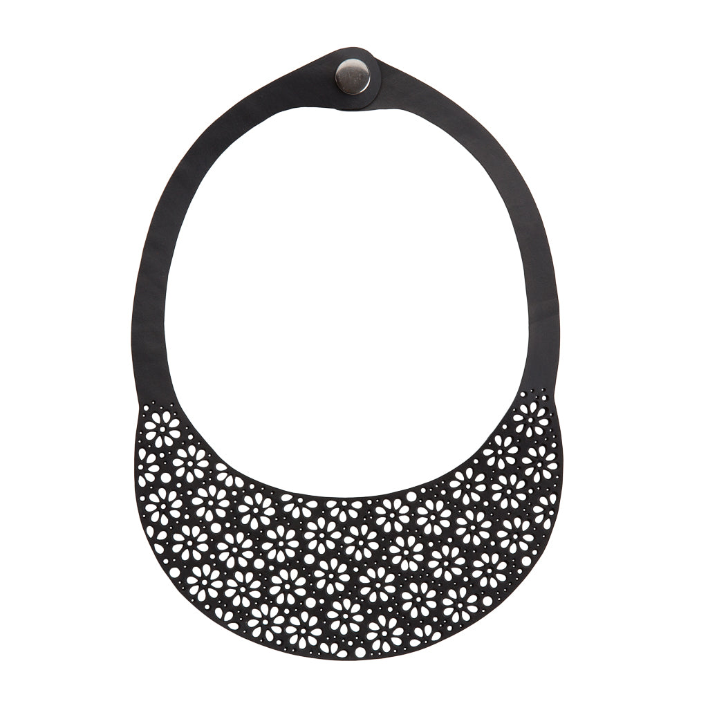 Paguro Upcycle upcycled inner tube necklace black crescent bib with daisy floral cutouts and snap closure