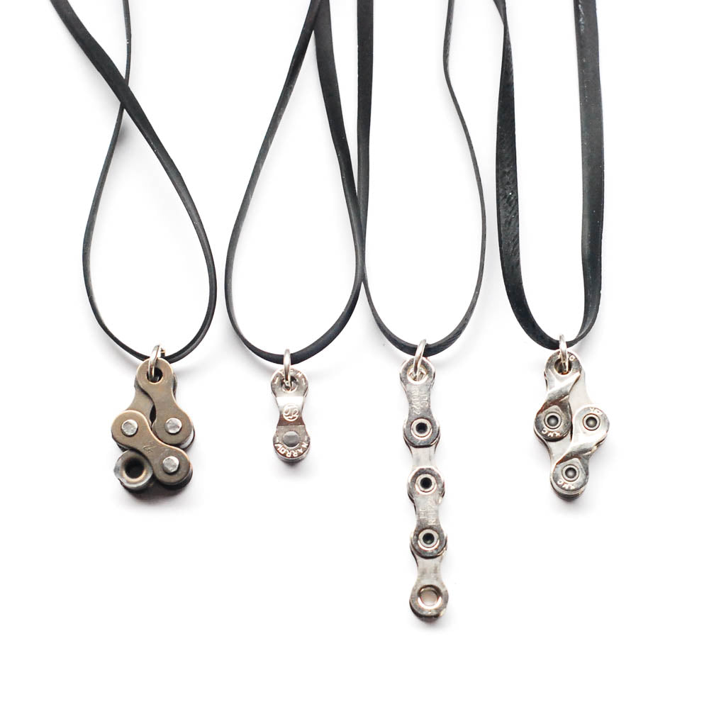 Paguro Upcycle recycled bike chain necklace set of four pendant styles on black leather cords
