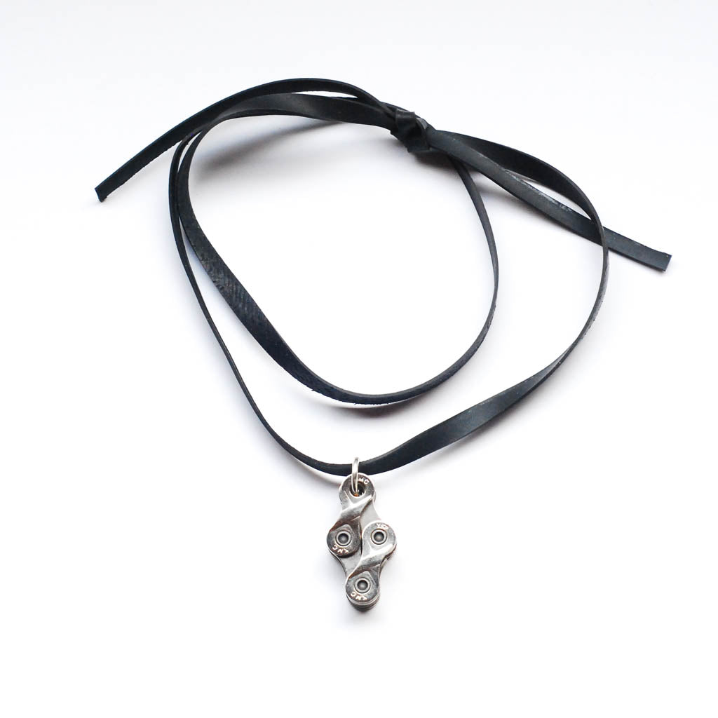 Paguro Upcycle recycled bike chain necklace on black leather ribbon choker with silver bike link pendant