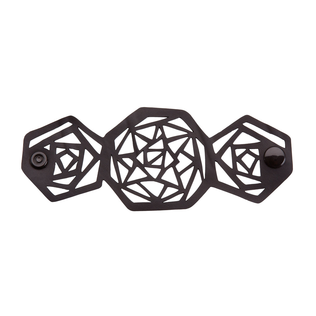 Paguro Upcycle black geometric recycled rubber bracelet with intricate cutout pattern and snap closure