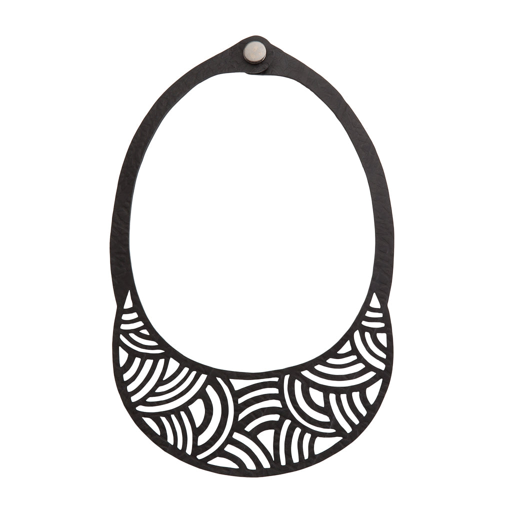 Paguro Upcycle upcycled inner tube necklace black cutout bib design with geometric wave pattern and snap closure